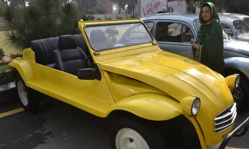 A woman visits the 12th Vintage and Classic Car Show in Peshawar, Pakistan, on Nov. 14, 2021.Photo:Xinhua