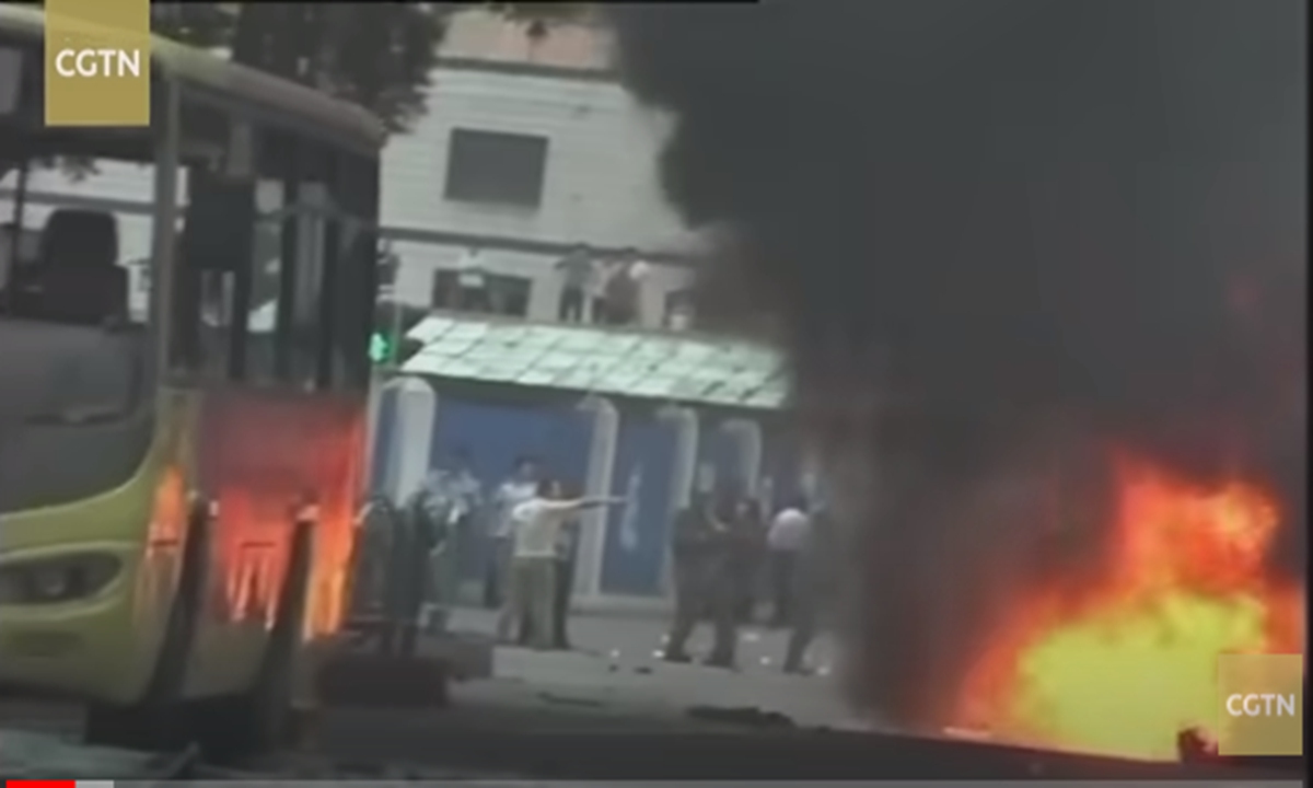 Footage of violent terrorists setting fire to a public place in Xinjiang Photo: Screenshot of a documentary on anti-terrorism in Xinjiang