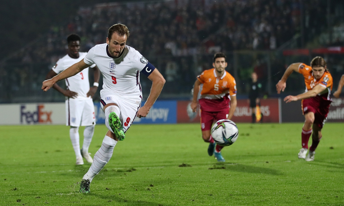 England's Harry Kane scores their third goal from the penalty spot against San Marino on Monday in Serravalle, San Marino. Photo: IC
