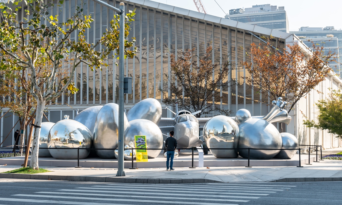A group of silver sculptures appear on a street in Shanghai. The sculptures, named