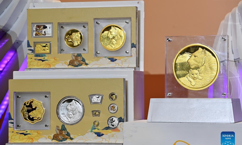 The commemorative coins to celebrate the Chinese zodiac Year of the Tiger are pictured in Beijing, capital of China, Nov. 18, 2021. Photo: Xinhua