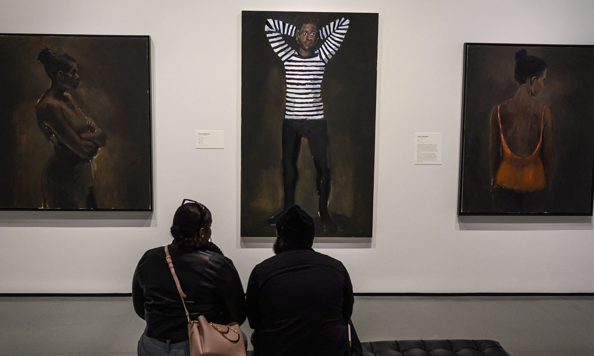 Visitors look at paintings by female artist Lynette-Boakye at the Baltimore Museum of Art on January 15, 2020 in Baltimore, Maryland, the US. Photo: AFP