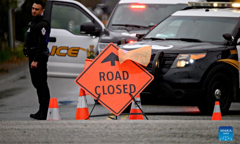 A road is closed due to floods caused by rainstorms in Abbotsford, Canada, Nov. 18, 2021. Incessant rainfall in the British Columbia brought floods to Abbotsford and the Fraser Valley that resulted in the provincial premier declaring a state of emergency. (Photo by Andrew Soong/Xinhua)