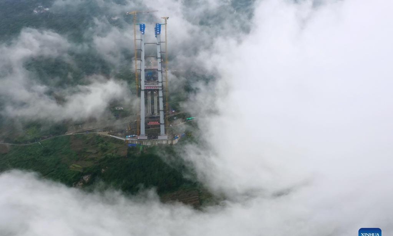 Aerial photo taken on Nov. 21, 2021 shows the main tower of Tongzi River grand bridge in southwest China's Guizhou Province. The main tower of the Tongzi River grand bridge was capped on Sunday. The 1,422-meter-long bridge is an important part of the Jinsha-Renhuai-Tongzi Highway. Photo: Xinhua