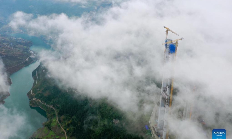 Aerial photo taken on Nov. 21, 2021 shows the main tower of Tongzi River grand bridge in southwest China's Guizhou Province. The main tower of the Tongzi River grand bridge was capped on Sunday. The 1,422-meter-long bridge is an important part of the Jinsha-Renhuai-Tongzi Highway.Photo: Xinhua