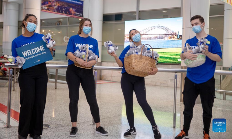 People welcome passengers from Singapore at Sydney Airport in Sydney, Australia, on Nov. 21, 2021. Australia's travel bubble with Singapore came into effect on Sunday.Photo: Xinhua
