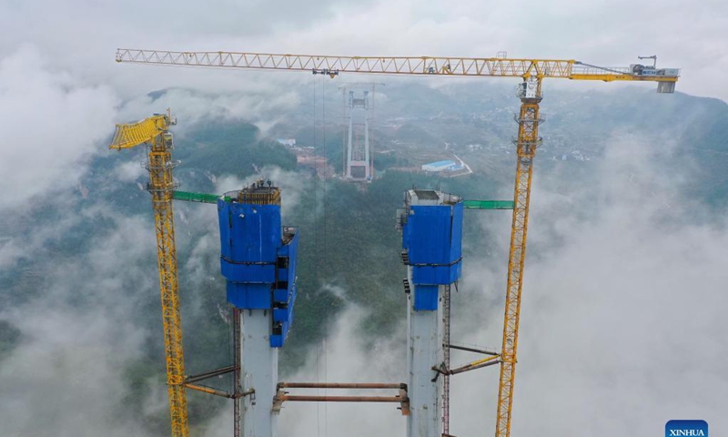 Aerial photo taken on Nov. 21, 2021 shows the main tower of Tongzi River grand bridge in southwest China's Guizhou Province. The main tower of the Tongzi River grand bridge was capped on Sunday. The 1,422-meter-long bridge is an important part of the Jinsha-Renhuai-Tongzi Highway.Photo: Xinhua