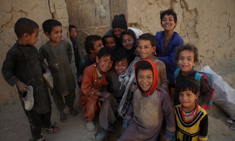 Afghan children pose for photos at an internally displaced persons (IDPs) camp in Kabul, capital of Afghanistan, Nov. 20, 2021.Photo:Xinhua