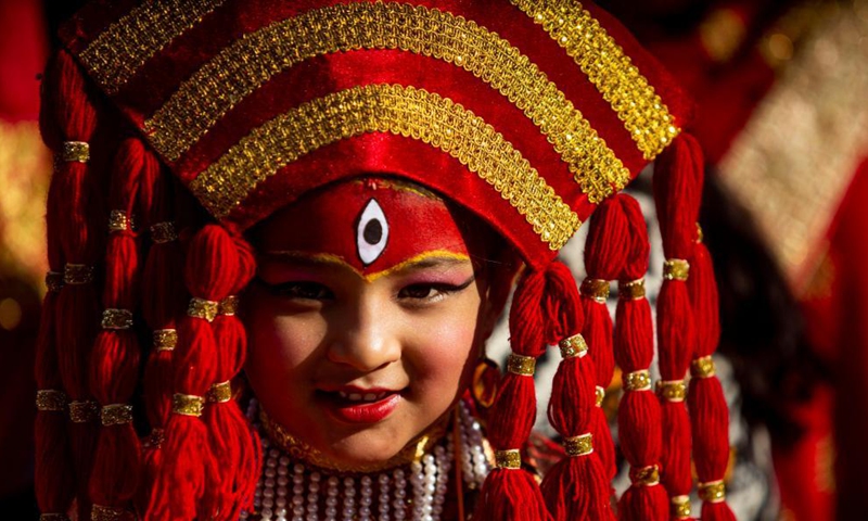 A girl dressed as living goddess Kumari takes part in a Hindu holy ritual on the occasion of World Children's Day in Kathmandu, Nepal on Nov. 20, 2021.Photo:Xinhua