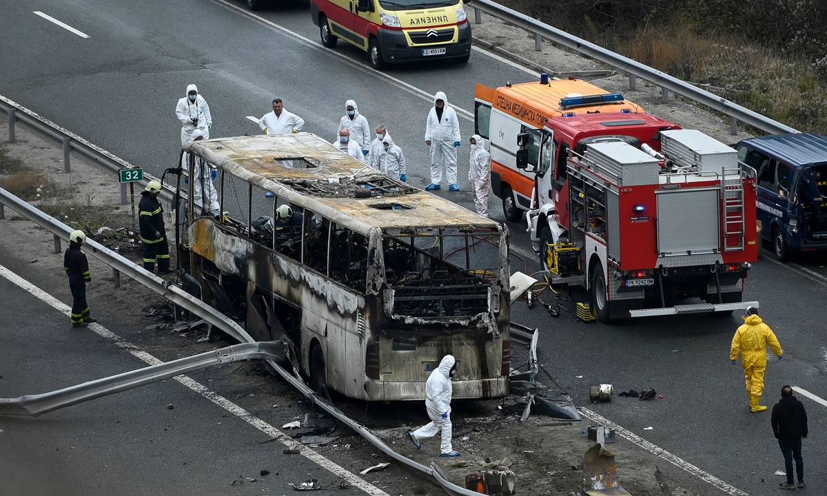 Officials work at the site of a bus accident, in which at least 46 people, including 12 children, were killed, on a highway near the village of Bosnek, Belgaria, on November 23, 2021. Seven escaped and were hospitalized after the bus crashed and caught fire. Most of those on board were tourists returning from a trip to Istanbul in Turkey. Photo: VCG