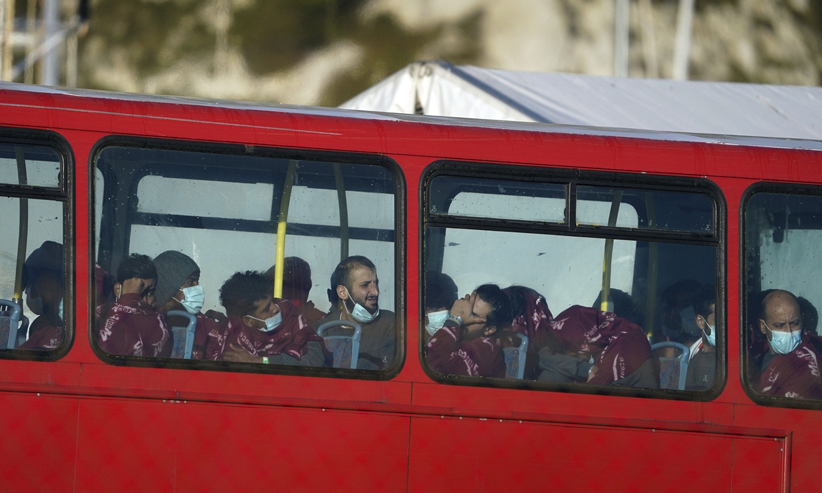People thought to be migrants sit on a bus in Dover, Kent, England on November 25, 2021. A boat from France sank in the English Channel on November 24, 2021, killing at least 31. Photo: VCG