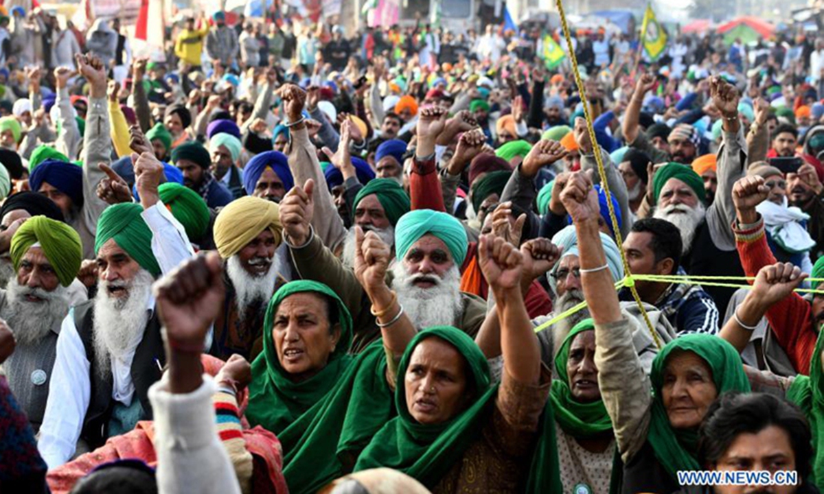 Farmers take part in a sit-in at Delhi Haryana Tikri Border in India, on Dec. 15, 2020. Thousands of farmers have been camping at several inter-state borders around Delhi, protesting against the three new farm laws enacted by the central government. Photo: Xinhua