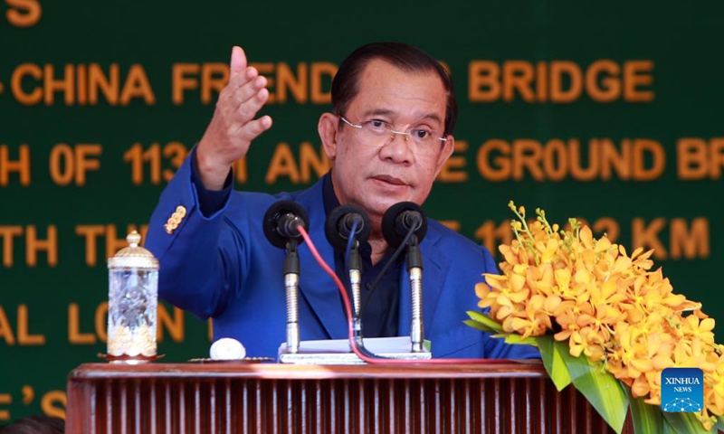 Cambodian Prime Minister Samdech Techo Hun Sen speaks during the inauguration ceremony of the eighth Cambodia-China Friendship Bridge in Stueng Trang district of Cambodia, Nov. 23, 2021. Spanning across the Mekong River and connecting Kampong Cham and Tboung Khmum provinces in southeastern Cambodia, the eighth Chinese-built friendship bridge has brought hope of development and ease of doing businesses to residents in both provinces.Photo: Xinhua 