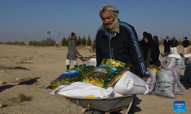 A man receives relief assistance donated by a local philanthropist in Nahr Shahi district of Balkh province, Afghanistan, Nov. 21, 2021.Photo:Xinhua