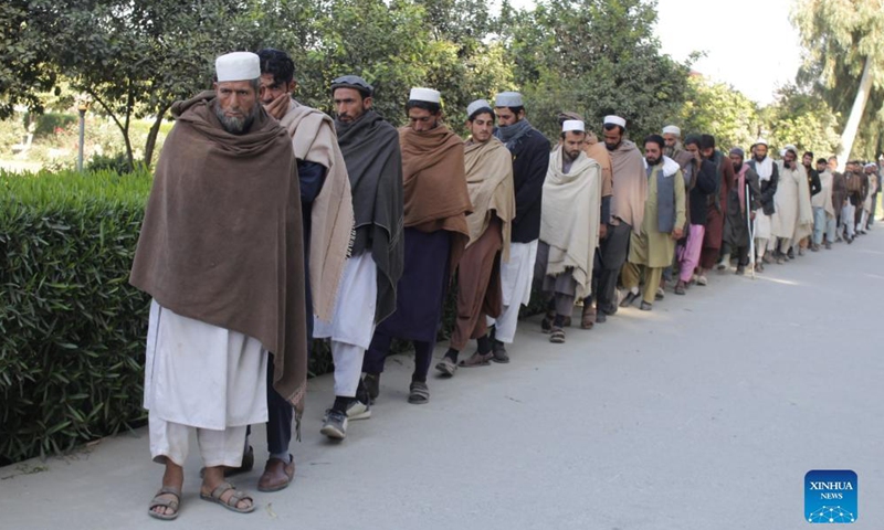 Islamic State (IS)-affiliated militants attend a surrender ceremony in Jalalabad, capital of Nangarhar province, Afghanistan, Nov. 23, 2021.Photo:Xinhua