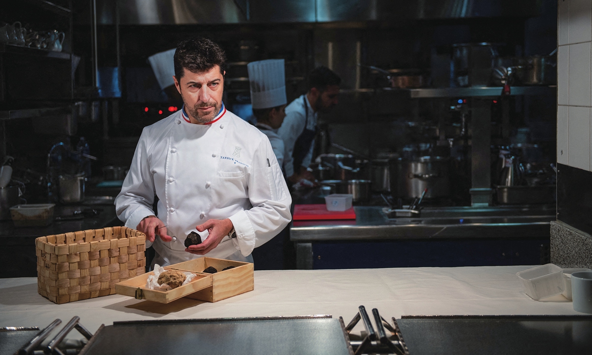 A French chef poses in his kitchen in Paris, on January 8, 2020. Photo: AFP
