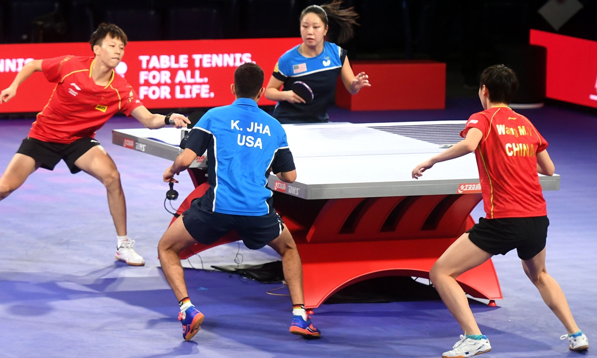 Lin Gaoyuan (4th from right) of China and Lily Zhang (2nd from right) of the US compete against Kanak Jha (3rd from right) of the US and Wang Manyu (1st from right) of China in a mixed doubles training session for the 2021 World Table Tennis Championships in Houston, Texas on November 22. Photo: Xinhua