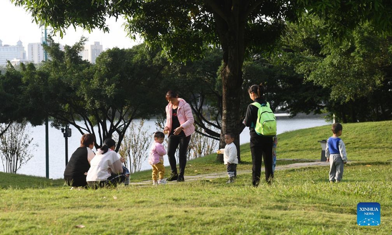 People relax near the Nanhu Lake in Nanning, south China's Guangxi Zhuang Autonomous Region, Nov. 23, 2021.Photo:Xinhua