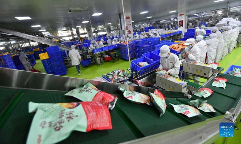 ers pack Luosifen rice noodles at a food-processing company in Liuzhou, south China's Guangxi Zhuang Autonomous Region, Nov. 23, 2021.Photo:Xinhua