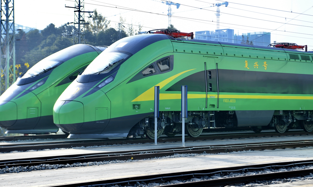 Two green Fuxing bullet trains are displayed at China Railway Chengdu Group Co in Southwest China's Sichuan Province on November 24, 2021. The updated trains use LED lighting that can work for 5 hours if the train's power supply fails. The maximum speed can reach 160 kilometers per hour. Photo: cnsphoto