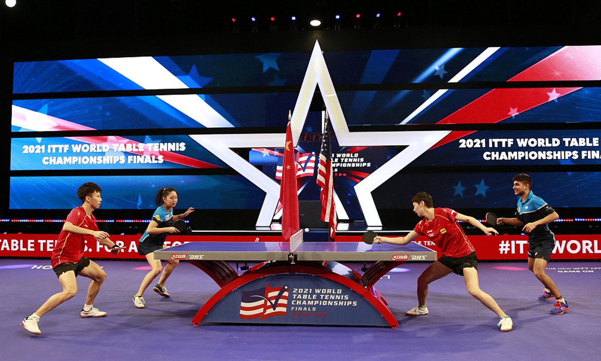 The US and Chinese national table tennis teams held a joint practice Monday night at the George R. Brown Convention Center, Houston, US. Photo: CFP