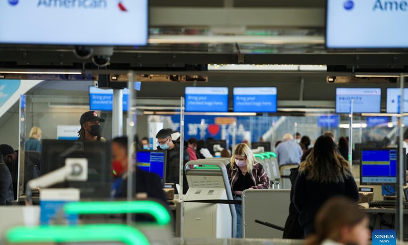 Travelers check in at LaGuardia Airport in New York, the United States, Nov. 24, 2021. The U.S. Transportation Security Administration (TSA) expects airport security checkpoints nationwide will be busy during the upcoming Thanksgiving travel period, which runs from Nov. 19 to 28.Photo: Xinhua