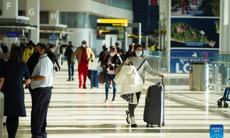 Travelers are seen at LaGuardia Airport in New York, the United States, Nov. 24, 2021. The U.S. Transportation Security Administration (TSA) expects airport security checkpoints nationwide will be busy during the upcoming Thanksgiving travel period, which runs from Nov. 19 to 28.Photo: Xinhua