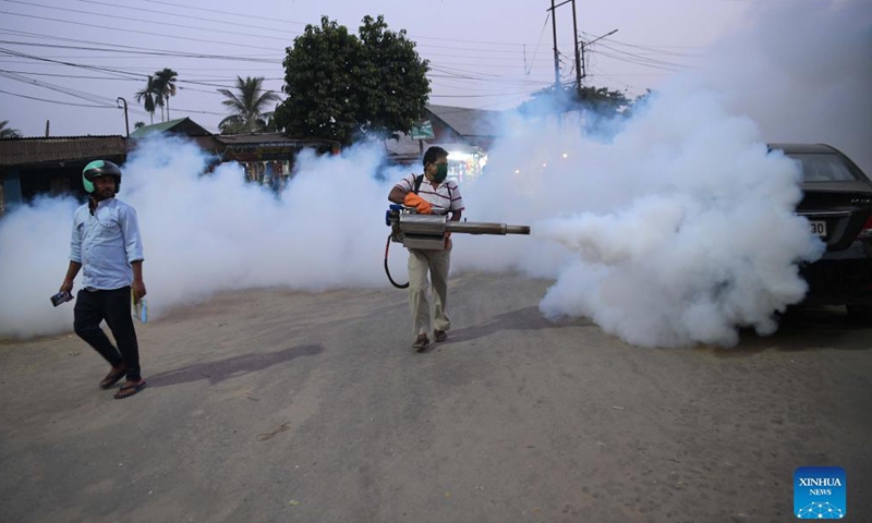A worker fumigates a slum area as a preventive measure against mosquito-born disease in Agartala, capital city of India's northeastern state of Tripura, Nov. 24, 2021.Photo:Xinhua