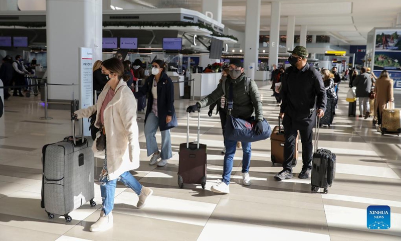 Travelers are seen at LaGuardia Airport in New York, the United States, Nov. 24, 2021. The U.S. Transportation Security Administration (TSA) expects airport security checkpoints nationwide will be busy during the upcoming Thanksgiving travel period, which runs from Nov. 19 to 28.Photo: Xinhua