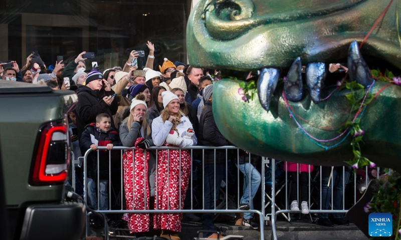 People watch the Macy's Thanksgiving Day Parade in New York, the United States, Nov 25, 2021.Photo:Xinhua