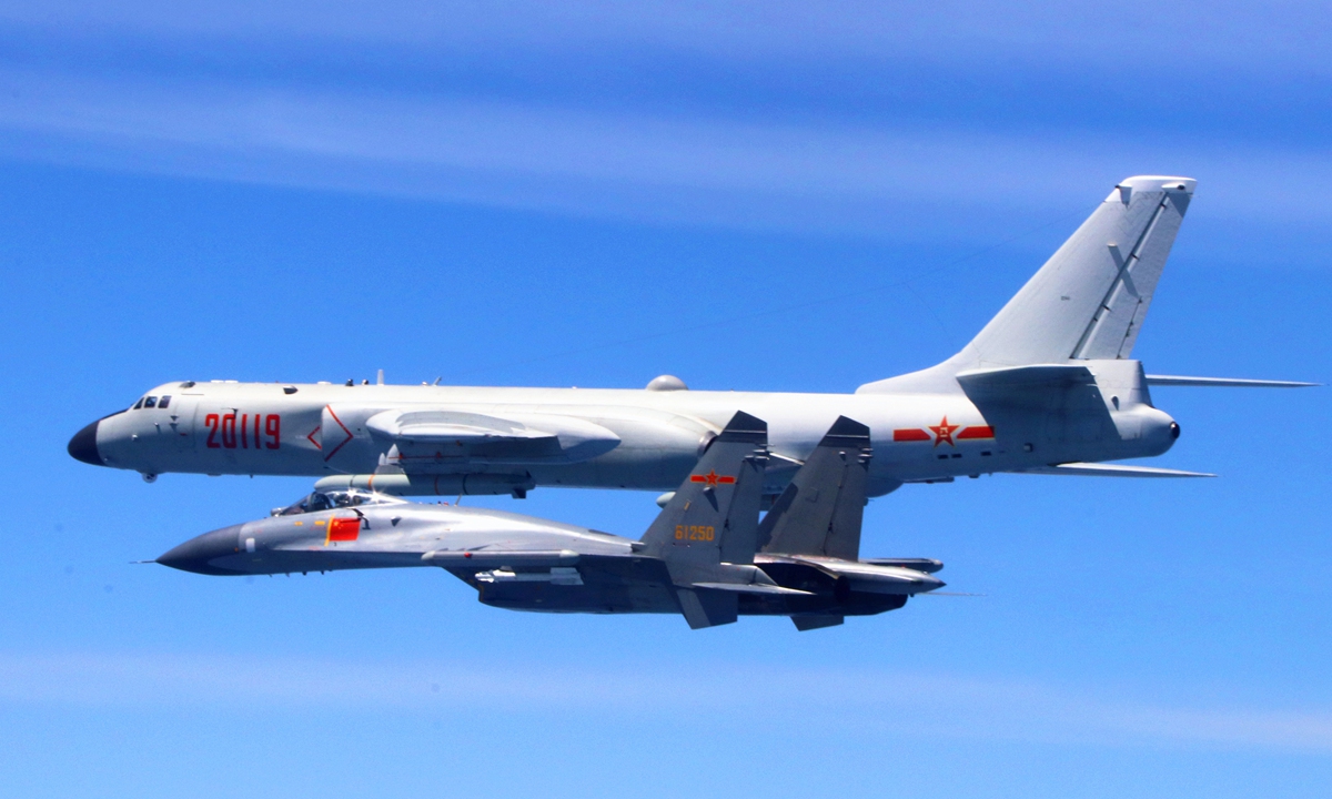 A Chinese People's Liberation Army (PLA) air force formation conducts island patrols during training on April 26, 2018. The formation was made up of fighters, early warning and surveillance aircraft, and H-6K bombers, which took off from various military airfields. The formation flew over the Miyako Strait and Bashi Channel, completing an island patrol, the subject of the training.Photo:Xinhua