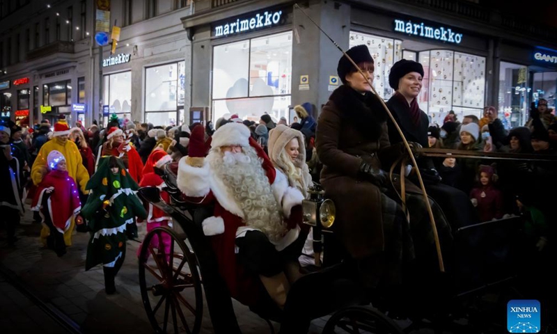 People take part in a parade during a traditional Christmas opening event in Helsinki, Finland, on Nov. 27, 2021.Photo:Xinhua