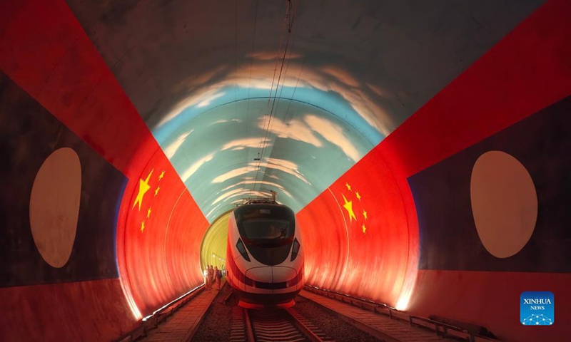 The Lane Xang EMU train passes by the China-Laos borderline inside a tunnel, Oct. 15, 2021. (Photo by Cao Anning/Xinhua)