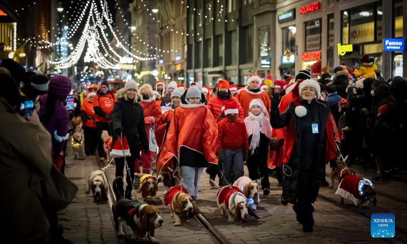 People take part in a parade during a traditional Christmas opening event in Helsinki, Finland, on Nov. 27, 2021.Photo:Xinhua