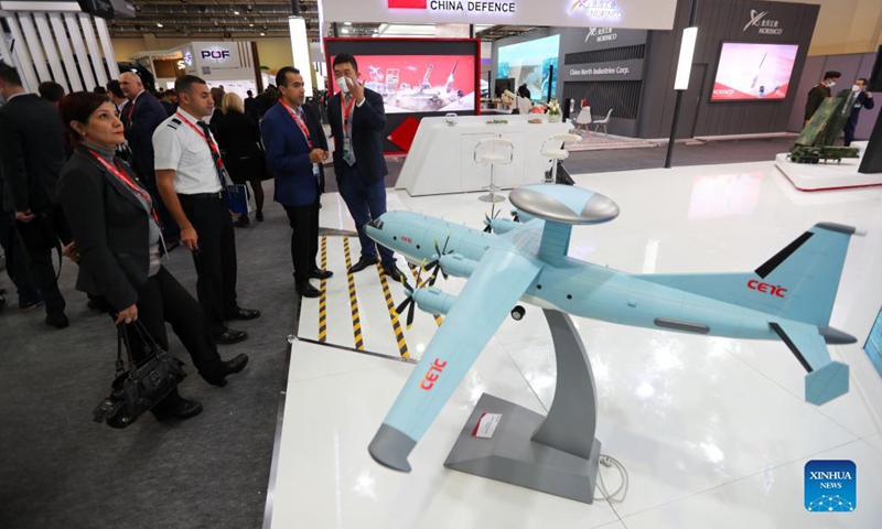 People stand near a model of ZDK-03 AWACS Aircraft at the booth of China Electronics Technology Group during an international defense expo in Cairo, Egypt, on Nov. 29, 2021. Egypt held on Monday the second edition of its largest international defense expo, EDEX 2021, with more than 400 defense companies from 42 countries, including China, showcasing their up-to-date defense products.(Photo: Xinhua)