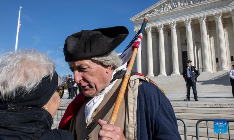 Anti-abortion protesters rally in front of the Supreme Court in Washington, D.C., the United States, Dec. 1, 2021. The conservative majority in the U.S. Supreme Court signaled Wednesday that they would uphold a law in the state of Mississippi barring abortion after 15 weeks of pregnancy, a decision directly contradicting the high court's landmark ruling in favor of abortion rights that has existed for nearly a half century.(Photo: Xinhua)