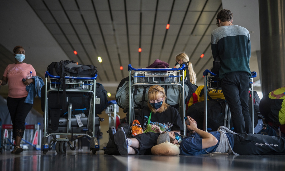 Students from Norway who were on a field trip to South Africa wait to be tested for COVID-19 before boarding a flight to Amsterdam at Johannesburg's O.R. Tambo International Airport on November 29, 2021. Photo: AFP