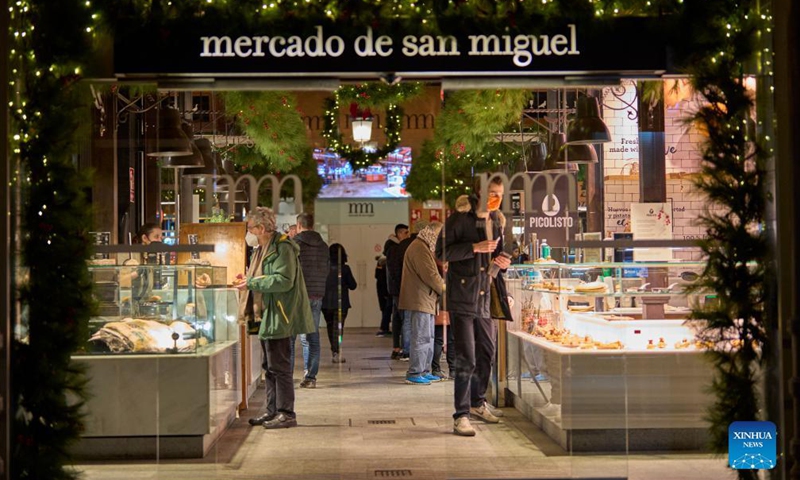 The San Miguel Market is decorated with festive lights for Christmas in Madrid, capital of Spain, Dec 2, 2021.Photo:Xinhua