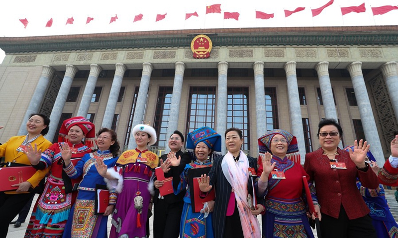 Deputies to the 13th National People's Congress (NPC) leave the Great Hall of the People after the closing meeting of the fourth session of the 13th NPC in Beijing, capital of China, March 11, 2021.(Photo: Xinhua)