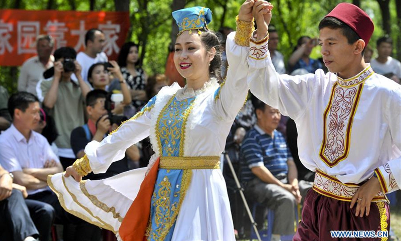 People dance during the Saban festival of Tatar ethnic group in Tacheng, northwest China's Xinjiang Uygur Autonomous Region, July 22, 2017. Xinjiang is a multi-ethnic region.(Photo: Xinhua)