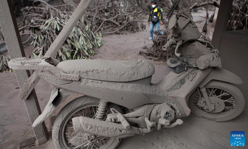 A motorbike is covered with volcanic ashes after Mount Semeru eruption at Sumberwuluh village in Lumajang, East Java, Indonesia, Dec. 5, 2021.Photo:Xinhua