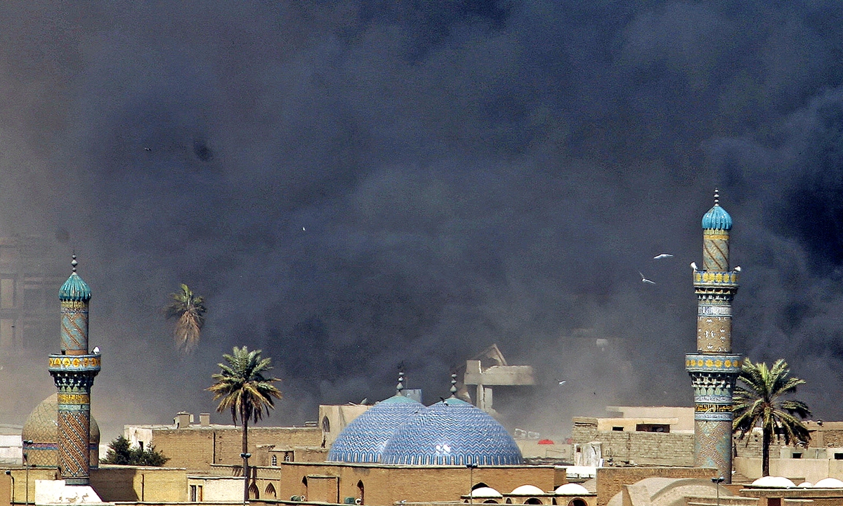 Smoke billowing from the site of a car bomb attack engulfs Bab al-Moazam Mosque in Baghdad on March 5, 2007. Photo: AFP
