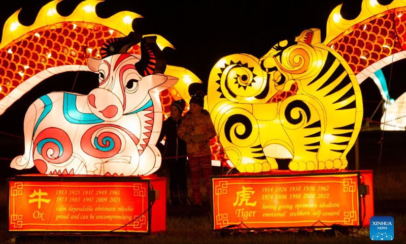 Visitors view light installations during the Seasky International Light Show in Niagara Falls, Ontario, Canada, on Dec. 4, 2021.Photo:Xinhua