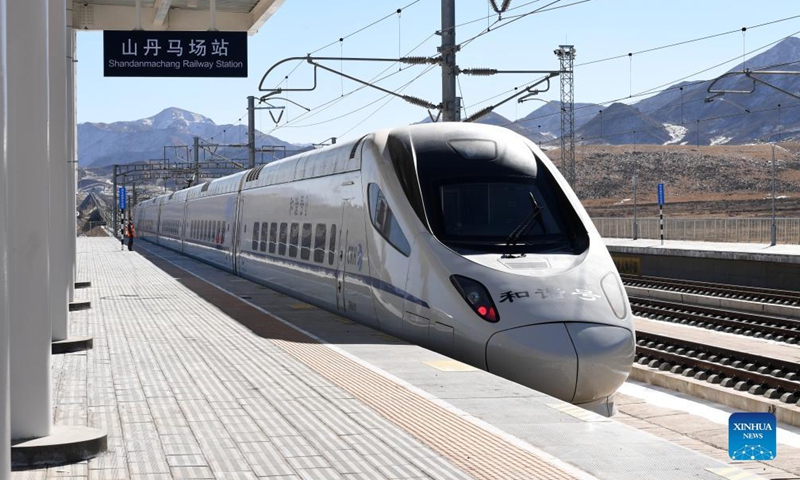 A bullet train pulls in at the Shandan Horse Ranch Railway Station of the Lanzhou-Xinjiang Railway in Shandan County, Zhangye City, northwest China's Gansu Province, Dec. 5, 2021.Photo:Xinhua