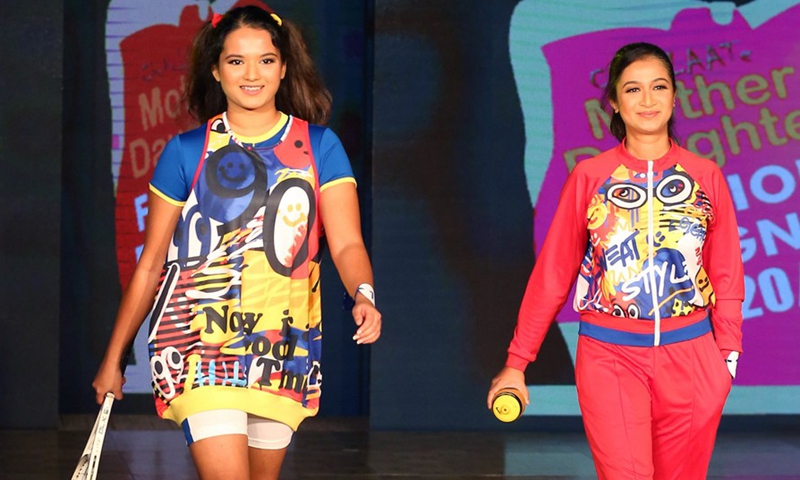 Models present creations during the Mother-Daughter fashion show in Colombo, Sri Lanka, on Dec. 5, 2021.(Photo: Xinhua)