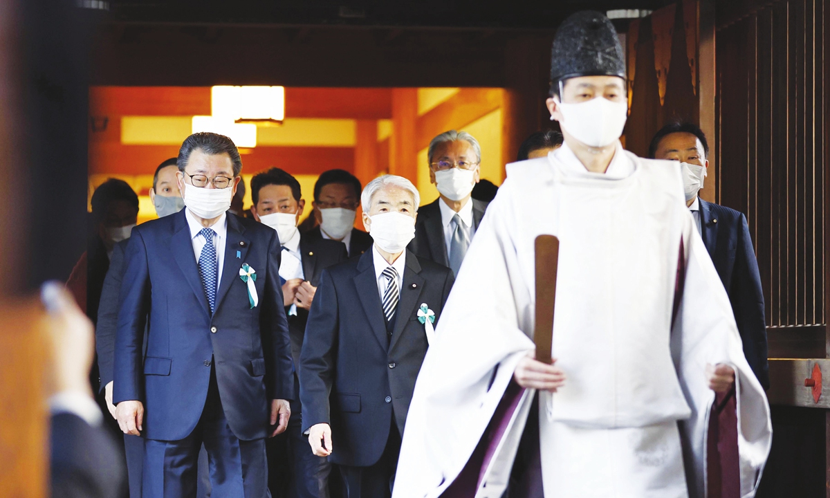 A nonpartisan group of Japanese lawmakers visits Yasukuni shrine, regarded as a symbol of Japan's past militarism by its Asian neighbors, in Tokyo, Japan on December 7, 2021. The group were making their first visit to the shrine, which honors convicted war criminals along with millions of war dead, in more than two years. Photo: VCG