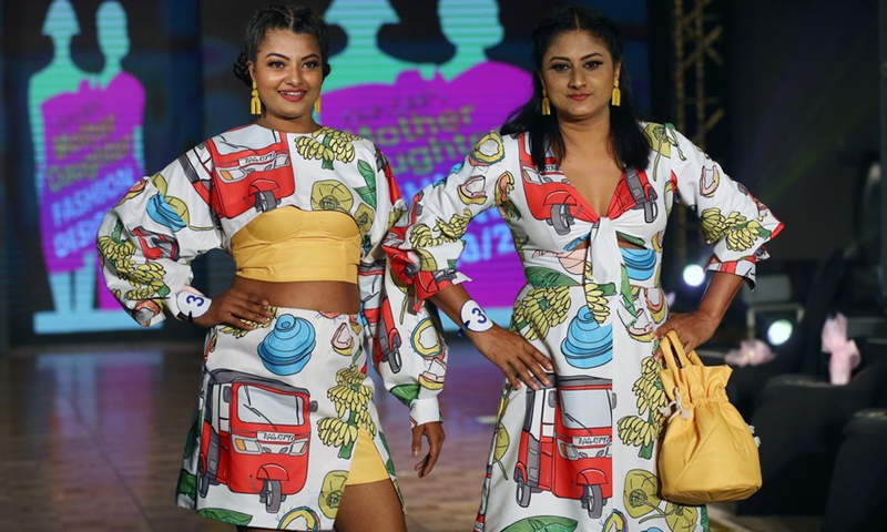 Models present creations during the Mother-Daughter fashion show in Colombo, Sri Lanka, on Dec. 5, 2021.(Photo: Xinhua)