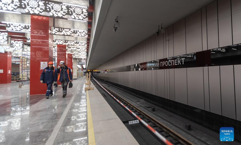 Workers walk at the Michurinsky Prospekt station in Moscow, Russia, Dec. 2, 2021. A new section of the Moscow Metro, part of which was built by China Railway Construction Corporation Limited (CRCC) was launched on Tuesday. It was the first time for Russia to introduce a Chinese enterprise in its metro construction, which was also marked as the first metro project of a Chinese company in Europe. (Xinhua)