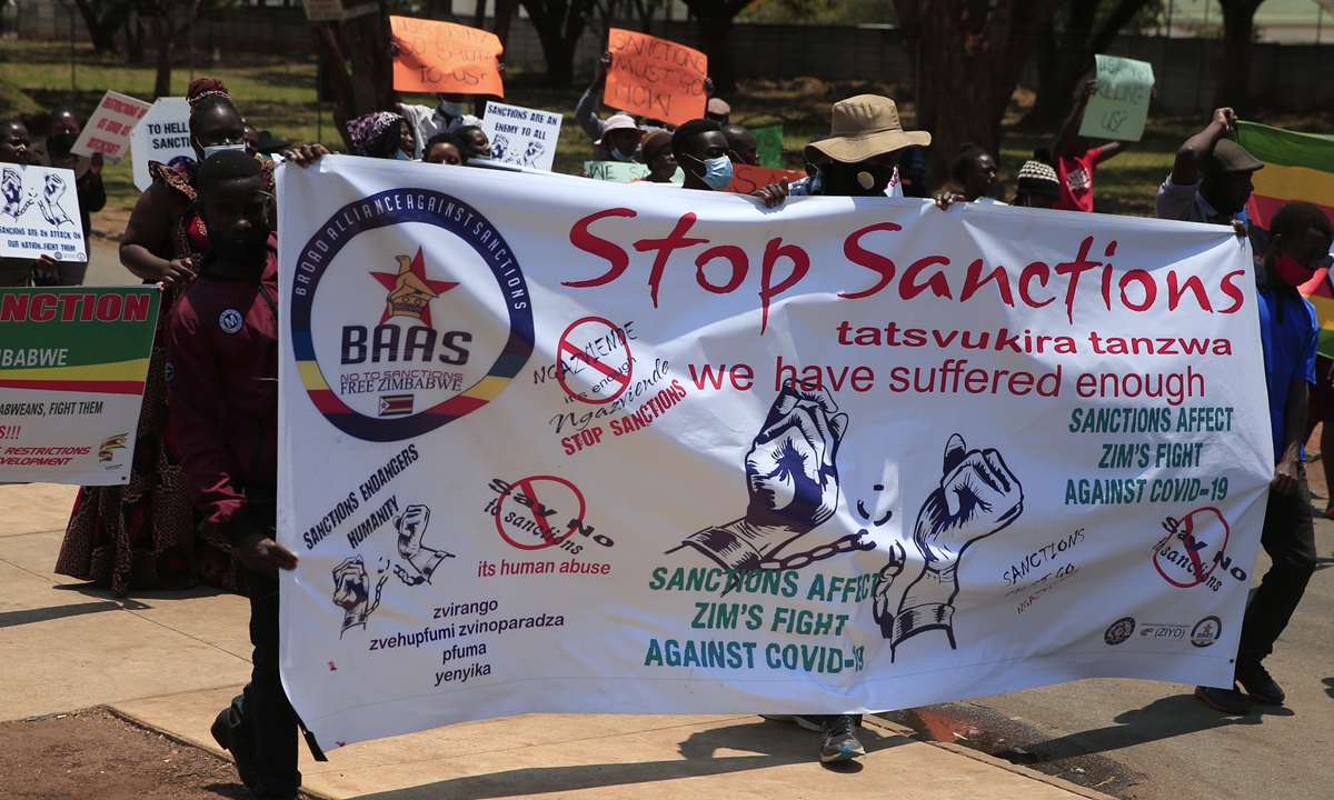 Zimbabweans protest against Western sanctions near the US embassy in Harare on October 25, 2021. Photo: Xinhua