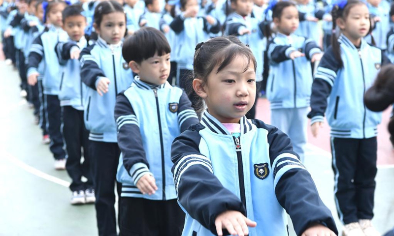 Students exercise at an elementary school in Nanning, capital of south China's Guangxi Zhuang Autonomous Region, Dec. 7, 2021.(Photo: Xinhua)